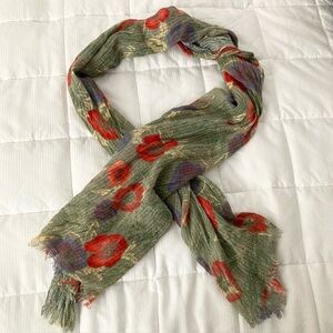 Kimchi Blue Scarf with Poppies on a green background with light fringe